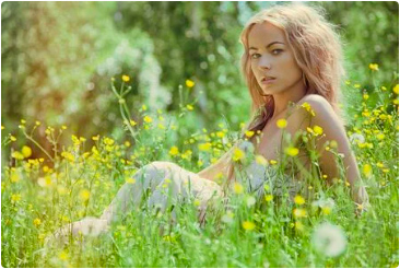 Woman laying in a flower field