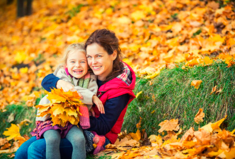 woman with girl in a park